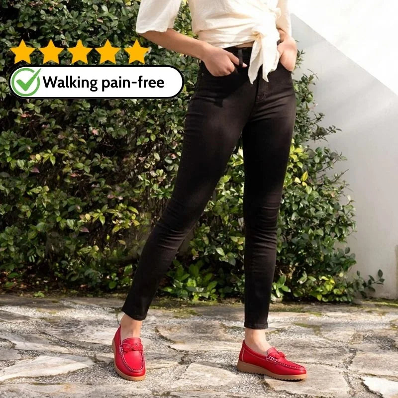 Woman wearing red wide fit slip-on loafers outdoors
