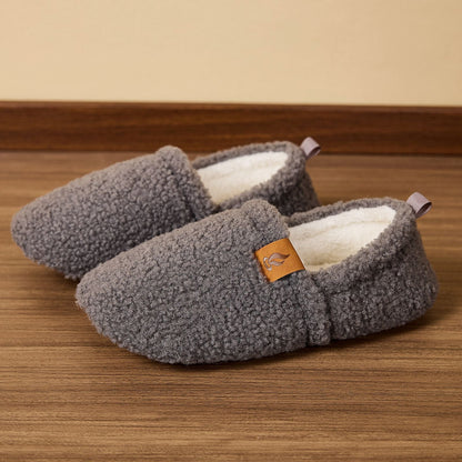 Auldweave women's warm shearling slippers – grey pair on a wooden floor