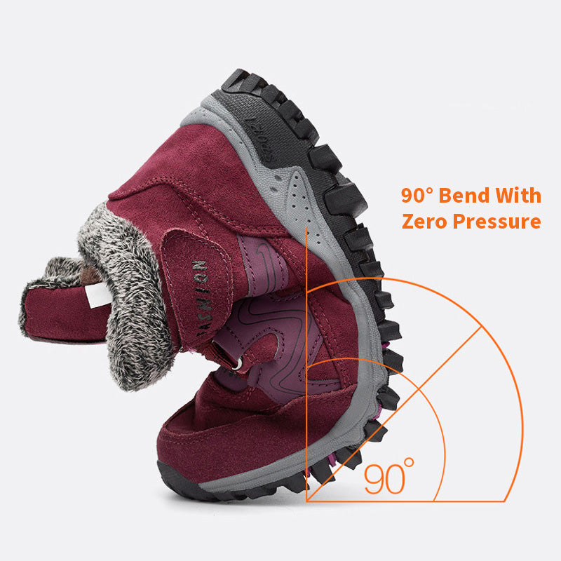 Burgundy winter boot bent to show sole flexibility