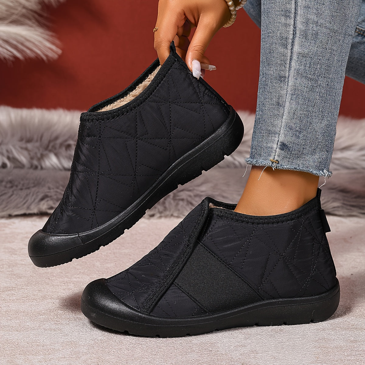 Fleece-lined slip-on ankle boots – black pair with pull tab