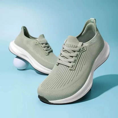 Sage green breathable knit trainers with a sculpted white sole