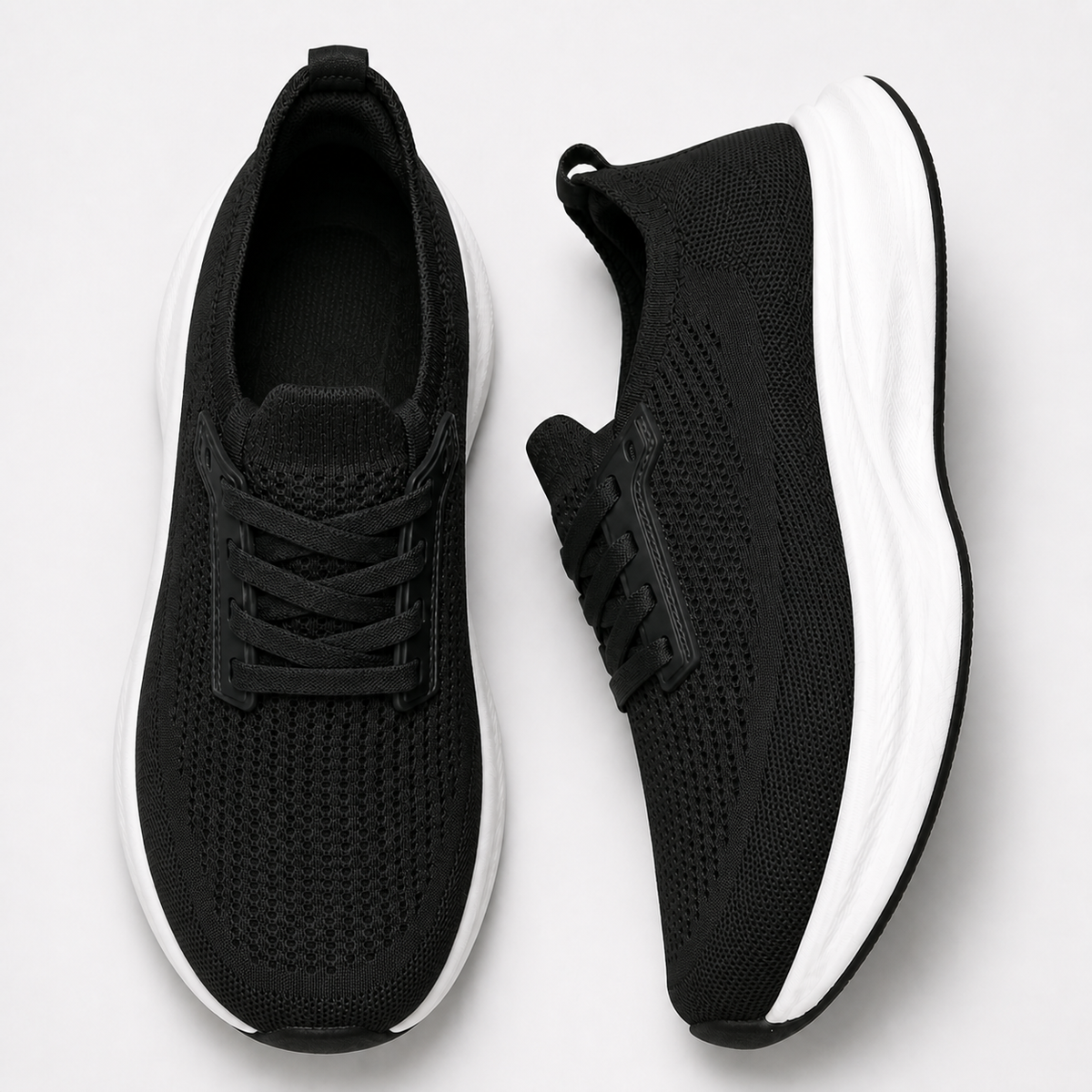 Black wide toe breathable knit trainers in top and side studio views