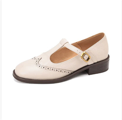Cream women's wide fit Mary Jane brogue flat with T-bar buckle strap, side view