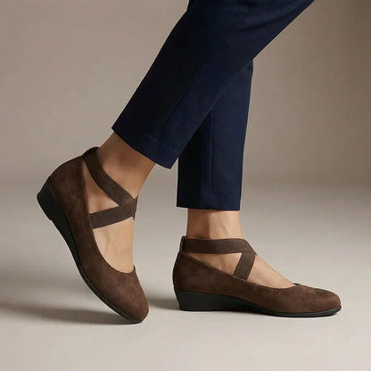 Brown cross-strap wedge flats, on-foot studio view