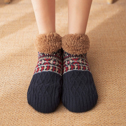 Auldweave unisex ultra-warm fleece-lined slipper socks – black pair worn indoors