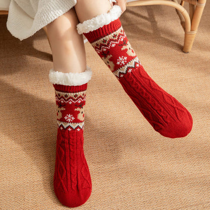 Christmas fleece-lined slipper socks – red pair worn indoors