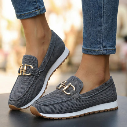 Women's grey loafers shown on foot
