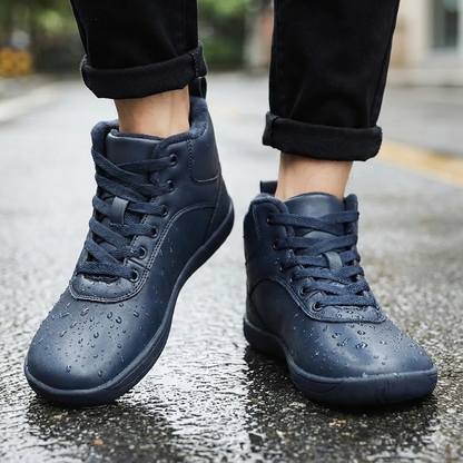 Fleece-lined lace-up winter boots – navy boots worn with water droplets on uppers