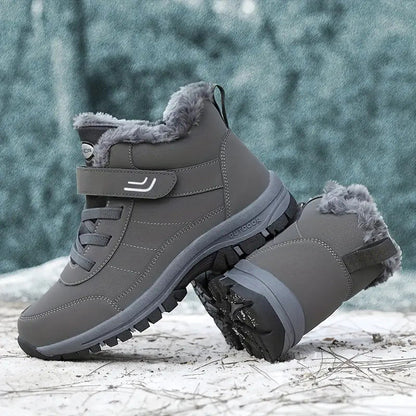 Grey winter boots showing the ankle strap and side profile