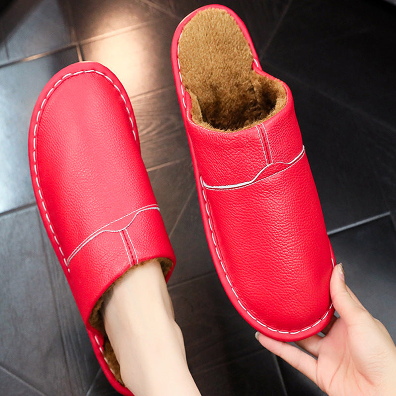 Auldweave warm wide fit leather slippers – red slipper worn with matching pair held