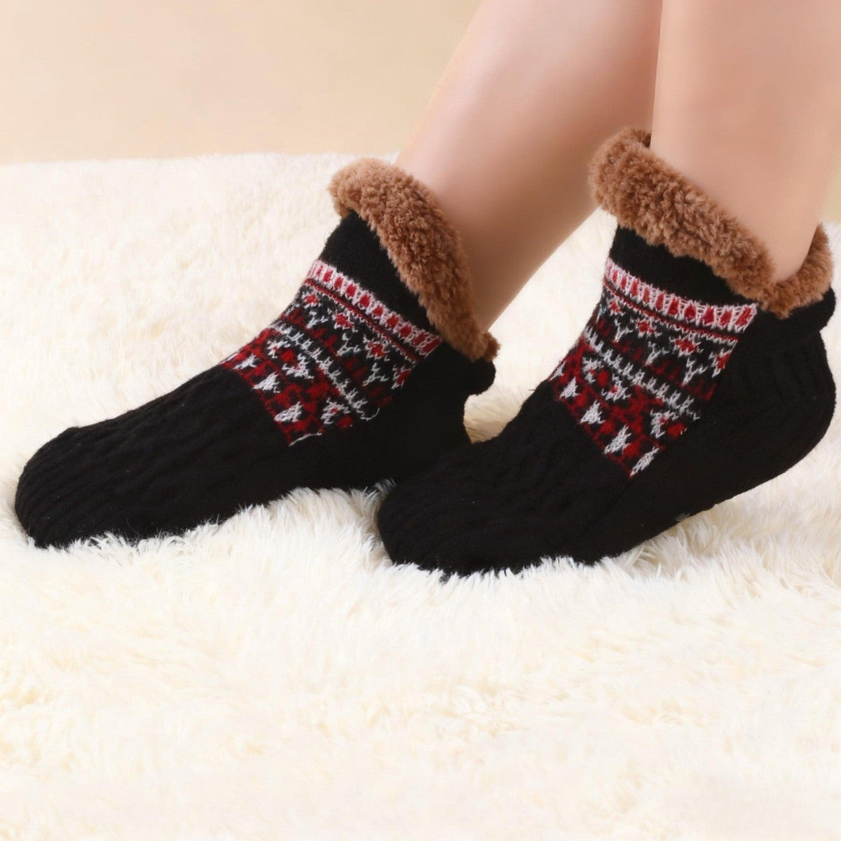 Auldweave warm fleece-lined slipper socks – black pair worn on a soft rug