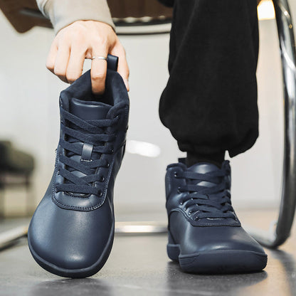 Fleece-lined lace-up winter boots – navy pair being put on
