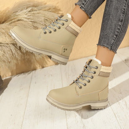 Faux-fur-lined winter ankle boots – beige pair worn indoors