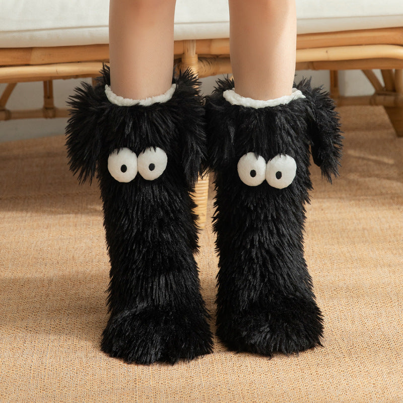 Fluffy dog slipper socks – black pair front view on feet