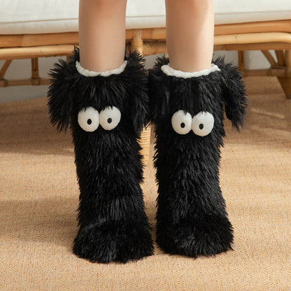 Fluffy dog slipper socks – black pair front view on feet