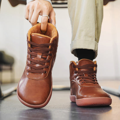 Fleece-lined lace-up winter boots – brown pair being put on