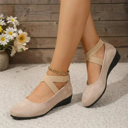 Beige cross-strap wedge flats for women, indoor on-foot view