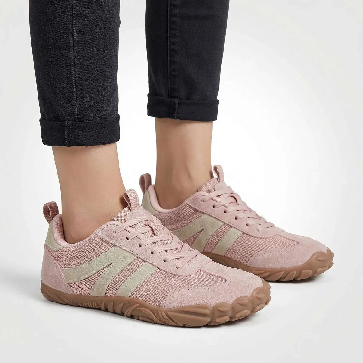 Pink walking trainers shown on foot