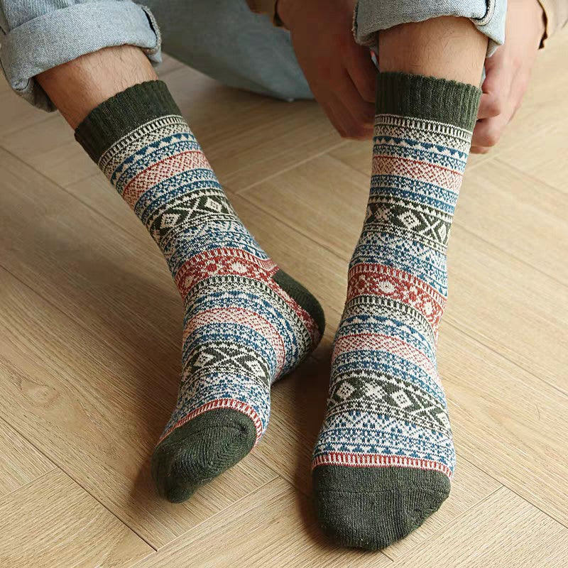 Five-pair Nordic-pattern winter socks – patterned pair worn indoors