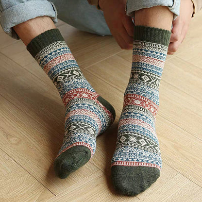 Five-pair Nordic-pattern winter socks – patterned pair worn indoors