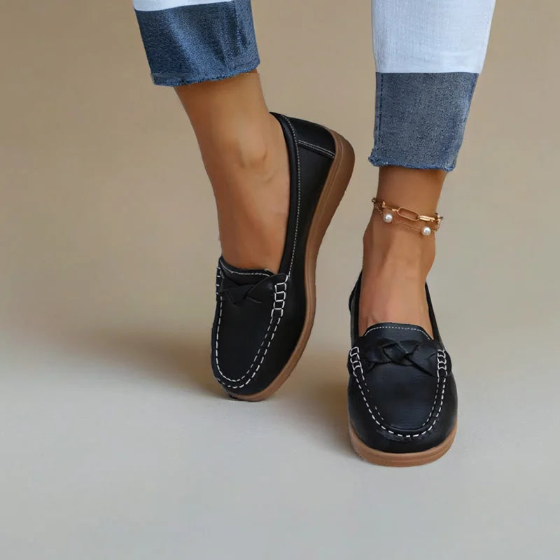 Black wide fit loafers for women, close on-foot studio view