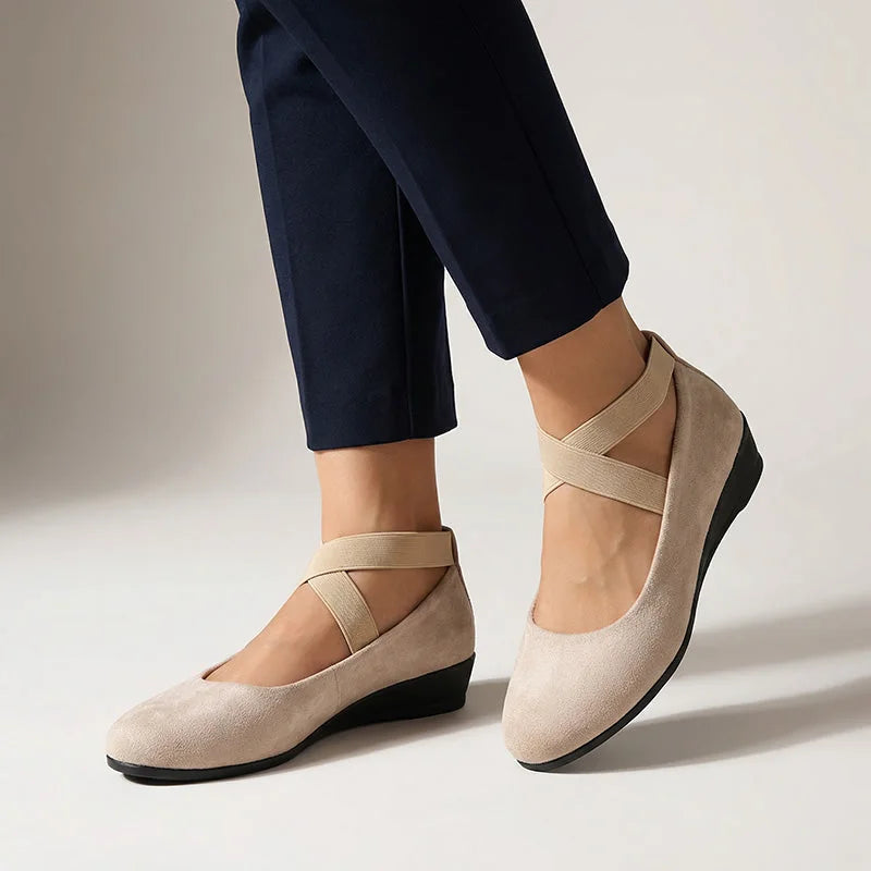Beige cross-strap wedge flats, on-foot studio view