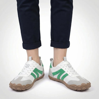 White walking trainers shown on foot