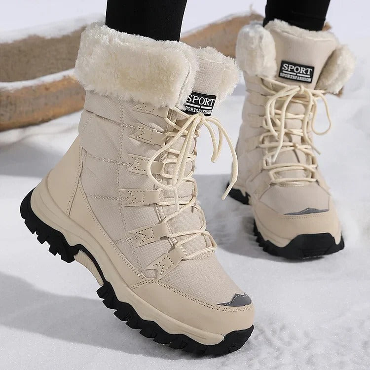Front view of beige winter boots showing the laces and fleece cuffs