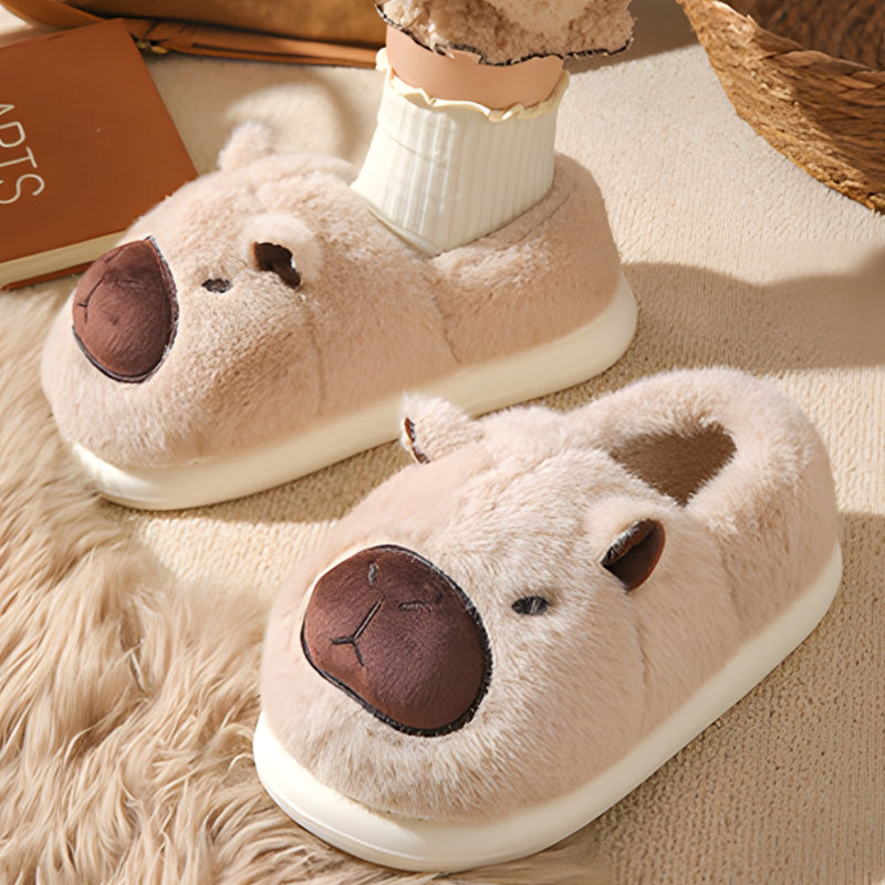 Auldweave women's fluffy capybara slippers – cream pair with one slipper worn