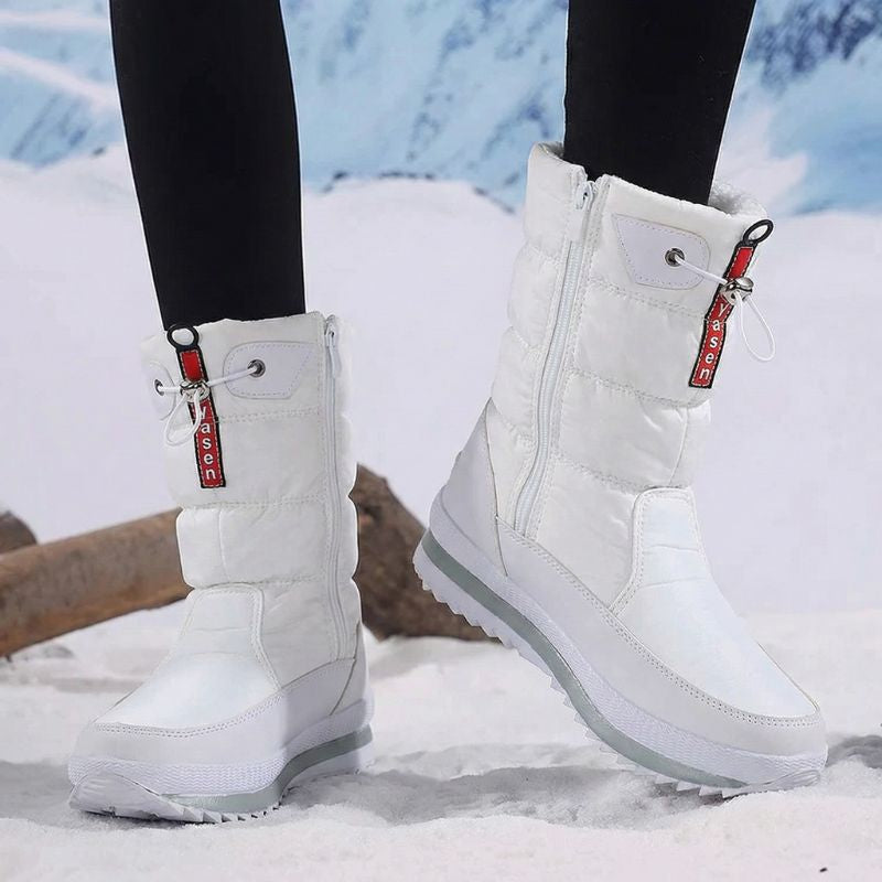 Auldweave women's waterproof mid-calf snow boots – white boots worn from the side in snow