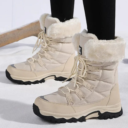 Beige lace-up winter boots with cream fleece cuffs worn on snowy ground
