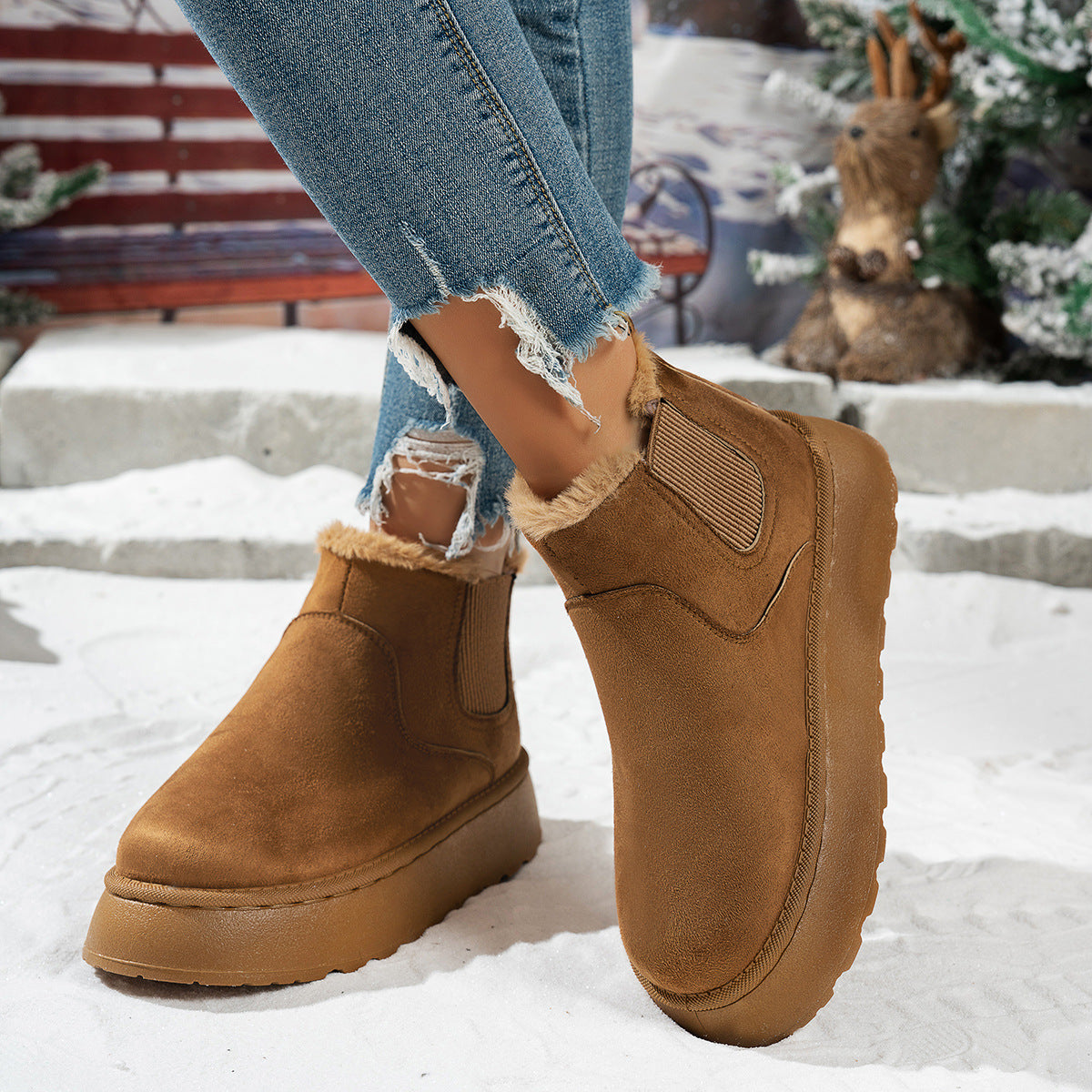 Plush-lined platform ankle boots – tan pair standing in snow