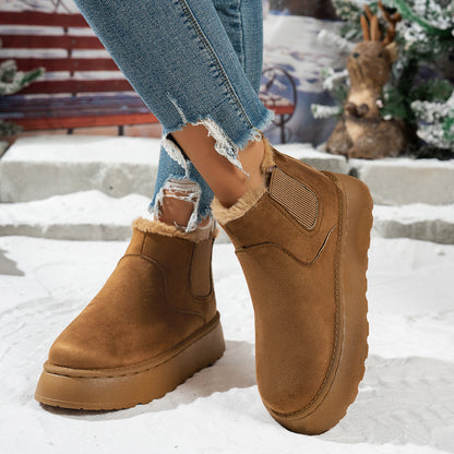 Plush-lined platform ankle boots – tan pair standing in snow