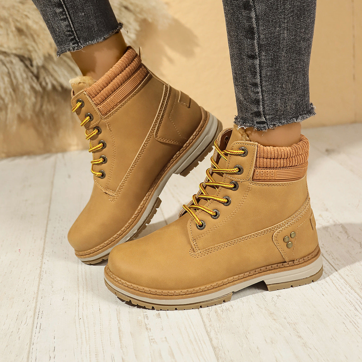 Faux-fur-lined winter ankle boots – tan pair worn indoors