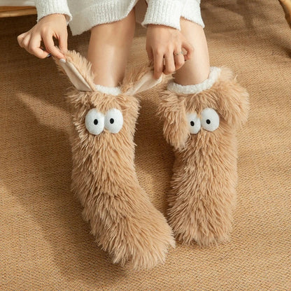 Fluffy dog slipper socks – tan pair with cuffs being stretched