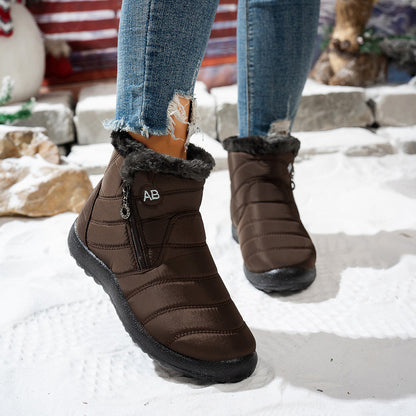 Brown quilted winter ankle boots worn outdoors