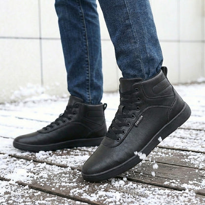 Fleece-lined lace-up winter boots – black pair on a snowy path