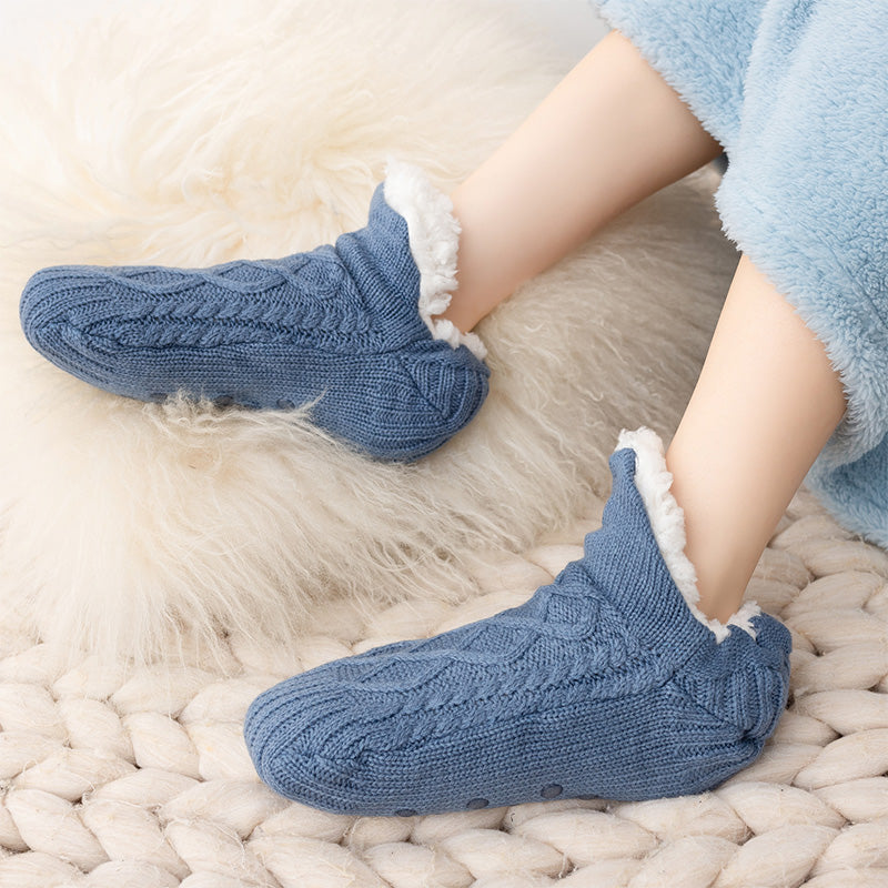 Auldweave unisex soft fleece-lined slipper socks – light blue pair worn on a soft rug
