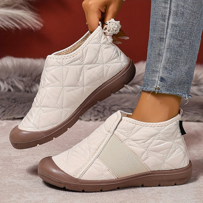 Fleece-lined slip-on ankle boots – cream pair showing pull tab