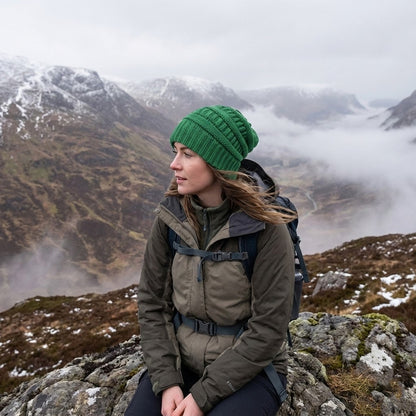 Cable-knit winter beanie – green beanie worn outdoors
