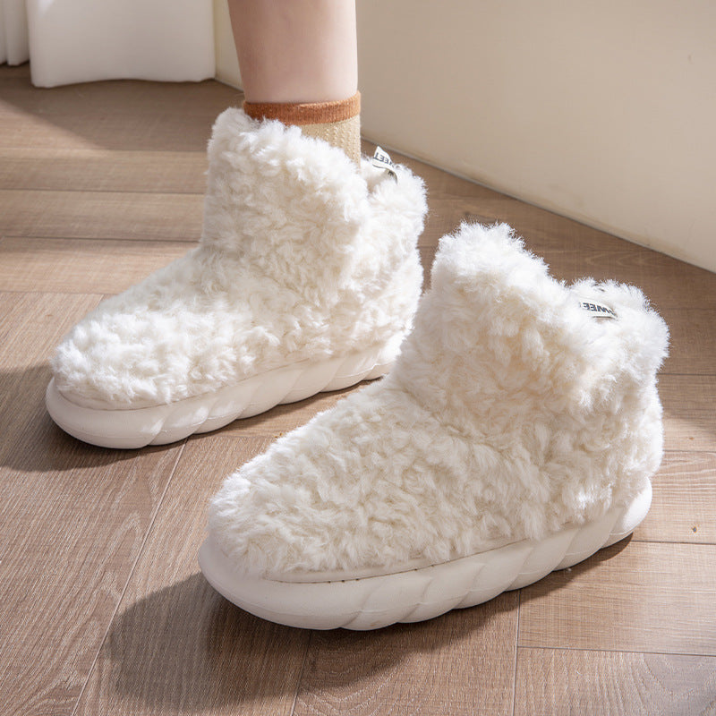 Plush fleece ankle slippers – cream pair on the floor
