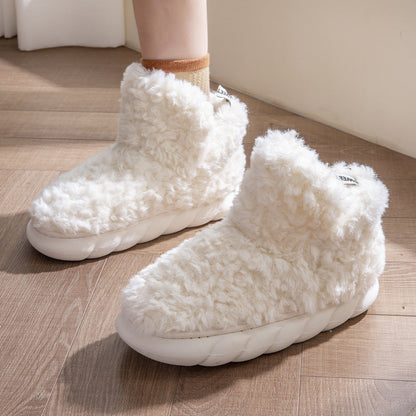 Plush fleece ankle slippers – cream pair on the floor
