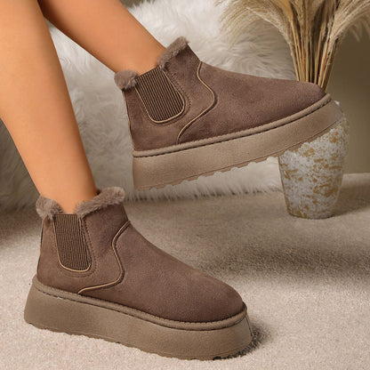 Plush-lined platform ankle boots – brown pair worn indoors