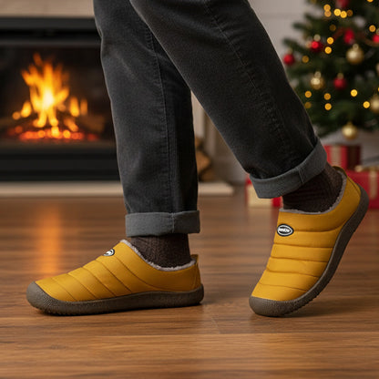 Fleece-lined winter clogs – yellow pair worn by a fireplace