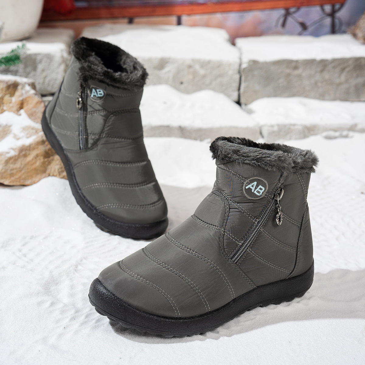 Side view of grey winter ankle boots with fleece collars