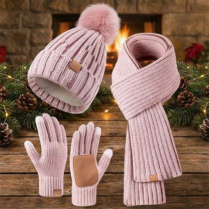 Winter hat scarf and glove set – pink set beside festive lights