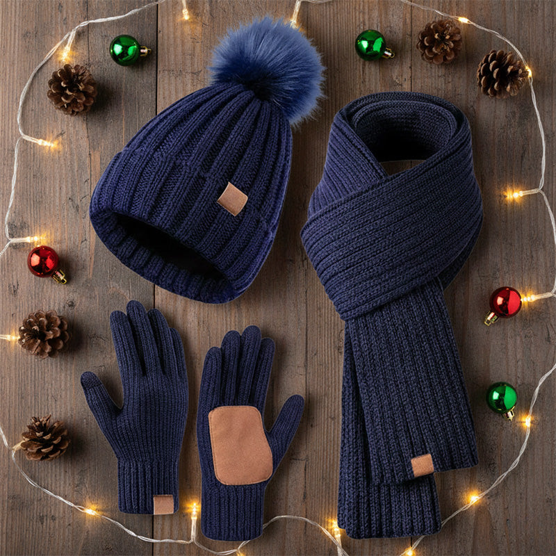 Winter hat scarf and glove set – navy set beside festive lights
