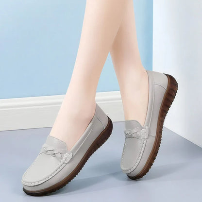 White bow-detail loafers for women, side on-foot studio view