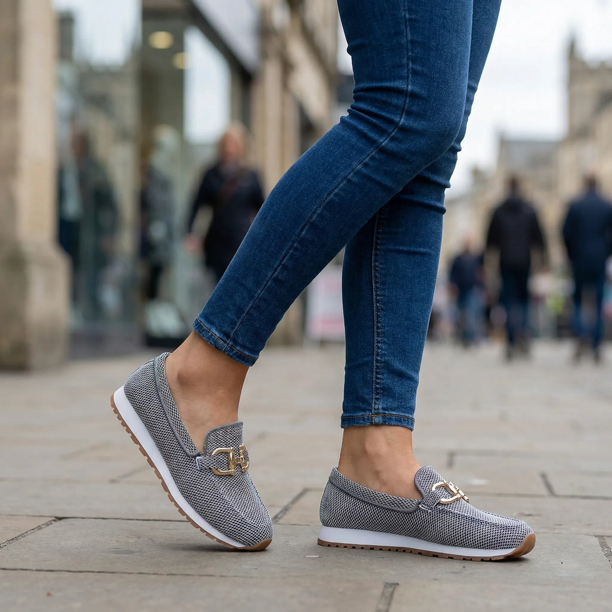 Women's grey loafers shown on foot
