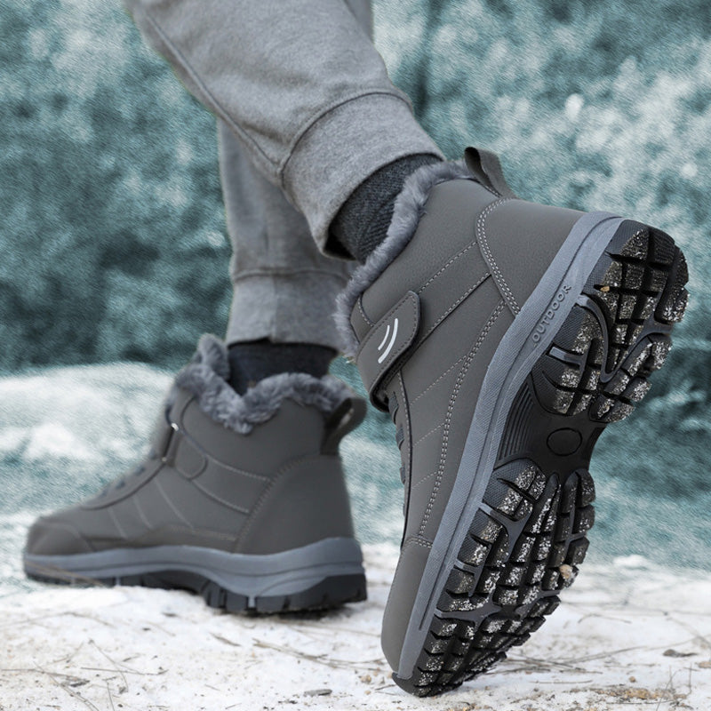Grey winter boots showing the textured outsole